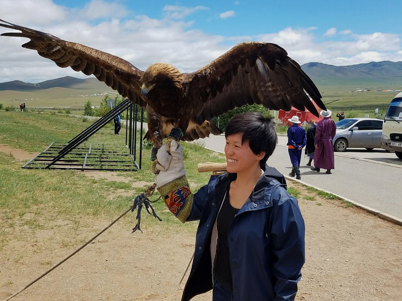 jenn holding an eagle